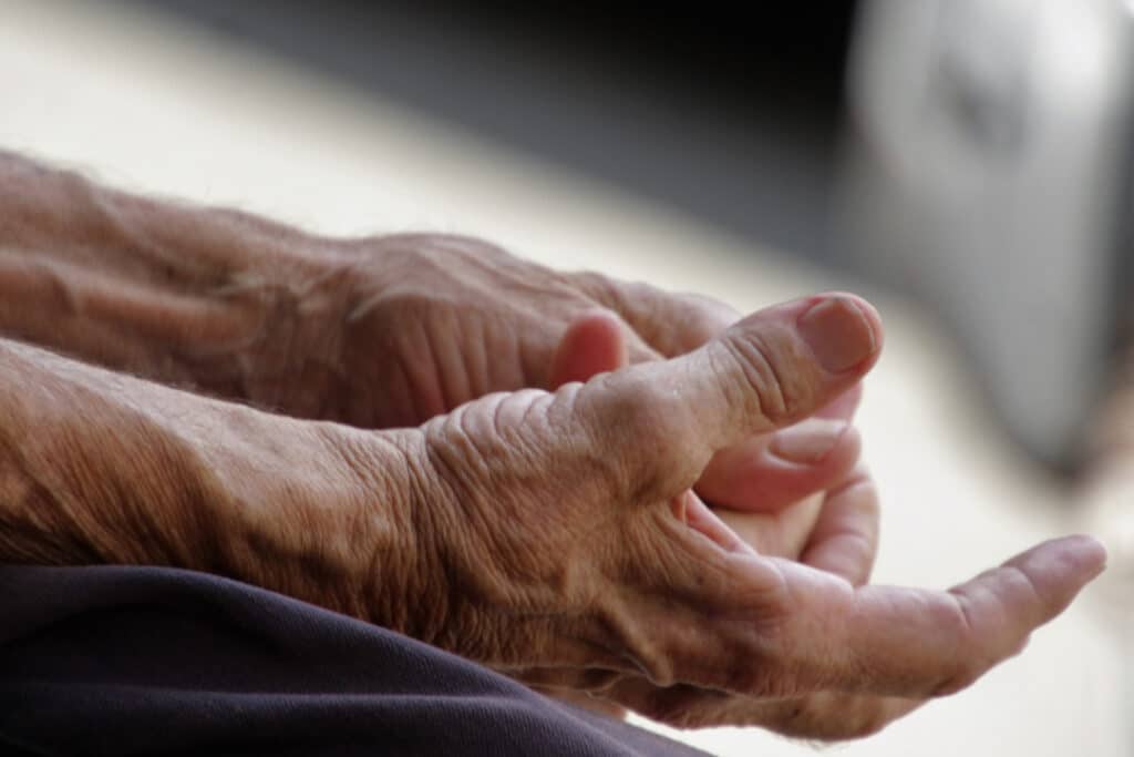 close-up-man-hand-bed