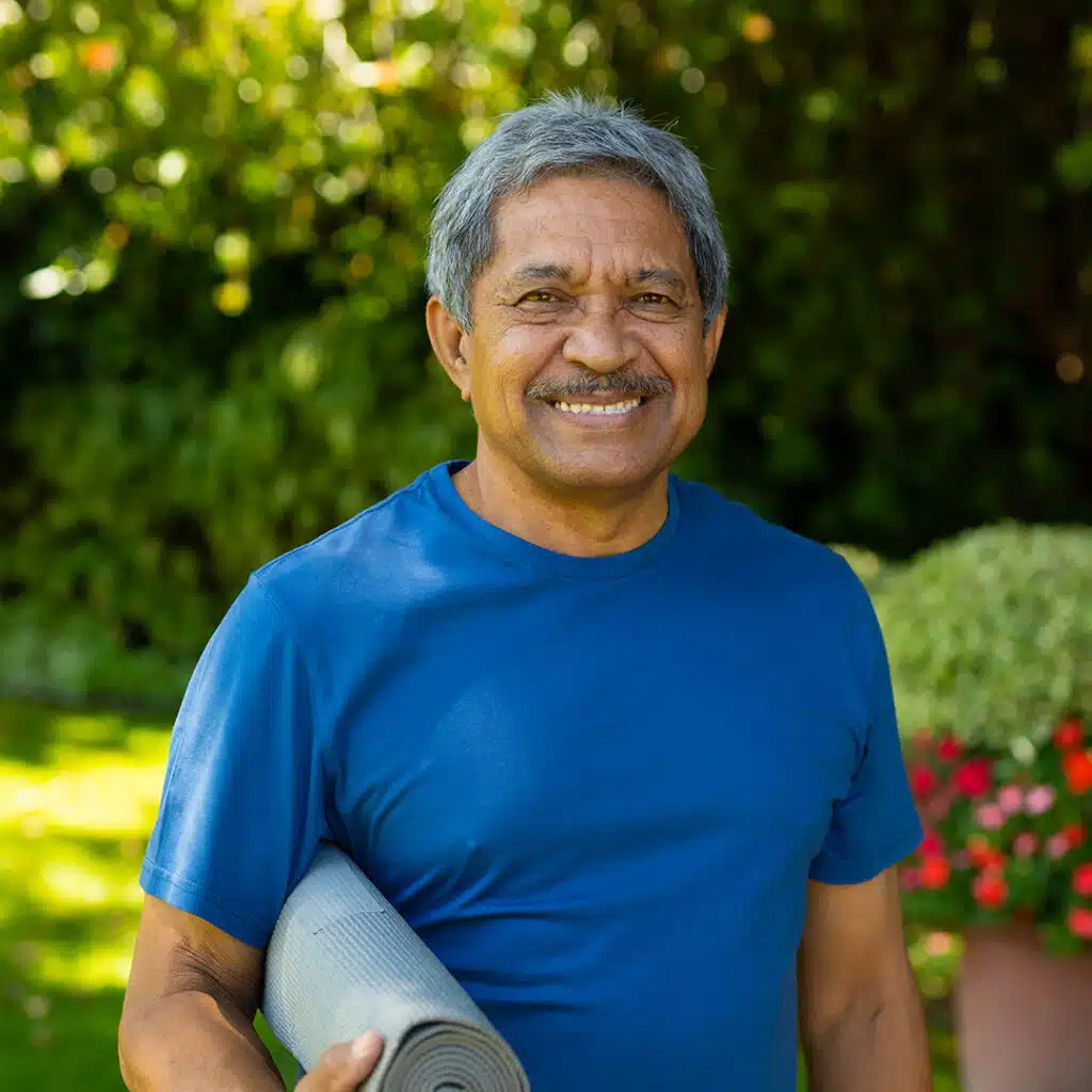 older-adult-man-running-front-camera-exercising-park