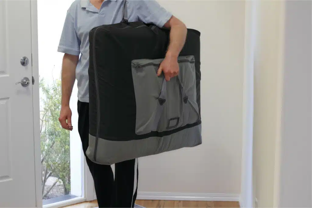 therapist bringing a massage table at the doorstep